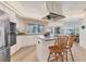 Well-appointed kitchen with stainless appliances and island with breakfast bar at 6702 Drewrys Blf, Bradenton, FL 34203