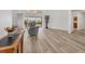 Spacious living room with light floors and view of the screened-in patio at 6702 Drewrys Blf, Bradenton, FL 34203