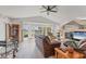 Spacious living room featuring a fireplace and large windows with water views at 6702 Drewrys Blf, Bradenton, FL 34203