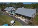 Aerial view of outdoor recreational area with dining, seating, tables and lake views in a scenic setting at 6702 Drewrys Blf, Bradenton, FL 34203