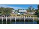 Community waterfront with wooden dock, benches, and covered grill at 6702 Drewrys Blf, Bradenton, FL 34203