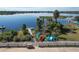 A lakefront shot featuring a pier, kayaks, and easy lake access at 6702 Drewrys Blf, Bradenton, FL 34203