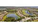 Gorgeous aerial view of a community with water features, golf course, and meticulously landscaped grounds at 7120 Quiet Creek Dr, Bradenton, FL 34212