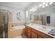 Bright bathroom with double sinks, soaking tub and glass shower enclosure at 7120 Quiet Creek Dr, Bradenton, FL 34212