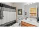Bathroom featuring a sink, toilet and a shower with a curtain at 7120 Quiet Creek Dr, Bradenton, FL 34212