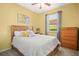 Bedroom featuring a bed, dresser and a window at 7120 Quiet Creek Dr, Bradenton, FL 34212