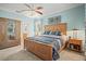 Light and airy primary bedroom with a comfortable bed, natural light, and ample closet space for a restful retreat at 7120 Quiet Creek Dr, Bradenton, FL 34212