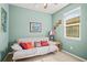 Bedroom featuring a daybed, a side table and a window with blinds at 7120 Quiet Creek Dr, Bradenton, FL 34212