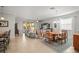 Open concept living and dining area with stylish decor and plenty of natural light at 7120 Quiet Creek Dr, Bradenton, FL 34212