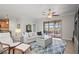 Comfortable living area featuring a plush sectional sofa, modern furnishings, and outdoor views at 7120 Quiet Creek Dr, Bradenton, FL 34212
