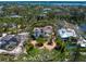 Beautiful aerial view showcasing the home's layout, circular driveway, and the surrounding landscape at 7333 Point Of Rocks Rd, Sarasota, FL 34242