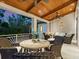 Inviting balcony area with wood ceiling, ceiling fans, and comfortable seating at 7333 Point Of Rocks Rd, Sarasota, FL 34242