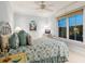 Bright bedroom with coastal decor featuring a queen bed and ample natural light at 7333 Point Of Rocks Rd, Sarasota, FL 34242