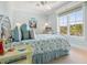 Brightly lit bedroom features nautical themed decor and large window at 7333 Point Of Rocks Rd, Sarasota, FL 34242