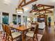 Inviting dining room showcases vaulted ceilings, exposed wood beams and seamless access to the living area at 7333 Point Of Rocks Rd, Sarasota, FL 34242