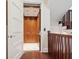 Interior elevator conveniently located between a staircase with wood railing in the home at 7333 Point Of Rocks Rd, Sarasota, FL 34242