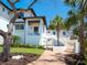 Beautiful multi-story home showcasing a brick walkway, manicured landscaping, and a welcoming entrance at 7333 Point Of Rocks Rd, Sarasota, FL 34242