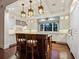 Elegant kitchen featuring white cabinets, stainless steel appliances, and hardwood floors at 7333 Point Of Rocks Rd, Sarasota, FL 34242