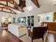 Spacious living room featuring hardwood floors, large windows, and an open floor plan at 7333 Point Of Rocks Rd, Sarasota, FL 34242