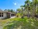 Sprawling backyard with mature trees surrounding the home on an oversized lot, and room for a pool at 734 Canal Rd, Sarasota, FL 34242