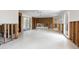 Spacious, open-concept living room with large windows, ceiling fan, and open wall studs ready for renovations at 734 Canal Rd, Sarasota, FL 34242