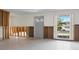 Spacious living room features a large window, with open wall studs for remodeling at 734 Canal Rd, Sarasota, FL 34242