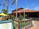 Colorful restaurant with outdoor seating under a sunny blue sky in Siesta Key at 734 Canal Rd, Sarasota, FL 34242