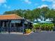 Charming Italian restaurant with outdoor seating, lush greenery, and inviting ambiance at 734 Canal Rd, Sarasota, FL 34242