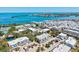Aerial view features luxurious bayfront condos, tropical landscaping, community parking and stunning water views at 750 Bayport Way # 750, Longboat Key, FL 34228