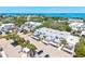 Aerial view of a charming community, lush landscaping, and easy access to the ocean at 750 Bayport Way # 750, Longboat Key, FL 34228