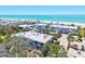 Coastal community near the beach with lush trees and modern architecture at 750 Bayport Way # 750, Longboat Key, FL 34228