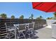 A modern deck with an umbrella offers a relaxing spot to soak in the sun at 750 Bayport Way # 750, Longboat Key, FL 34228