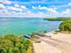 Boat ramp with piers and lush greenery at 750 Bayport Way # 750, Longboat Key, FL 34228