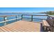 Waterfront view from the dock with a built-in bench, offering a peaceful spot to enjoy the scenery at 750 Bayport Way # 750, Longboat Key, FL 34228