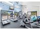 Well-equipped fitness center with modern exercise machines and views of the outdoors at 750 Bayport Way # 750, Longboat Key, FL 34228