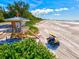 Aerial view of lifeguard station with parked vehicle and beach at 750 Bayport Way # 750, Longboat Key, FL 34228