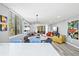 Open-concept living area with modern furnishings, stylish lighting, and expansive windows at 750 Bayport Way # 750, Longboat Key, FL 34228