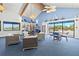 Comfortable lounge setting with wicker furniture, nautical decor, and lots of natural light at 750 Bayport Way # 750, Longboat Key, FL 34228