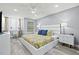 Bright bedroom with a king bed, stylish decor, and a view of the neighborhood at 750 Bayport Way # 750, Longboat Key, FL 34228