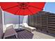 Private patio with lounge chairs and a side table, perfect for relaxing and soaking up the sun at 750 Bayport Way # 750, Longboat Key, FL 34228