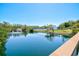 A pond view showcasing the complex's many amenities, including a pond, fountains, and sports courts at 750 Bayport Way # 750, Longboat Key, FL 34228
