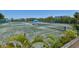 A full view of the tennis courts featuring two shaded resting areas for players to use during matches at 750 Bayport Way # 750, Longboat Key, FL 34228