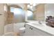 Bright bathroom featuring a white vanity, modern fixtures, and walk-in shower at 7624 Boltons Ct, Bradenton, FL 34201