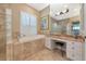 Luxurious bathroom featuring a soaking tub, vanity area, and natural light at 7624 Boltons Ct, Bradenton, FL 34201