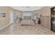 Light-filled bedroom with neutral tones, plantation shutters, and tile flooring at 7624 Boltons Ct, Bradenton, FL 34201