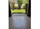 View from inside garage looking out, highlighting landscaping and an outdoor view at 7624 Boltons Ct, Bradenton, FL 34201