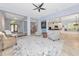 Spacious living room with neutral decor, open to the kitchen and dining areas at 7624 Boltons Ct, Bradenton, FL 34201