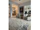 A spacious living room with access to the dining room and kitchen at 7624 Boltons Ct, Bradenton, FL 34201
