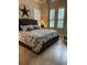 A tastefully decorated primary bedroom featuring tile floors, and ceiling fan at 7624 Boltons Ct, Bradenton, FL 34201