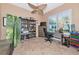 Functional office featuring tile floors, built-in shelving and a large window at 7624 Boltons Ct, Bradenton, FL 34201